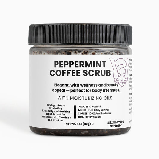 Peppermint Coffee Scrub beside fresh mint leaves – energizing body exfoliant made with Arabica coffee and essential oils for glowing skin